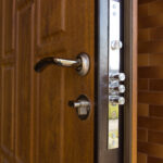 New,Steel,Three,Bolt,Door,Lock,Installed,On,The,Wooden
