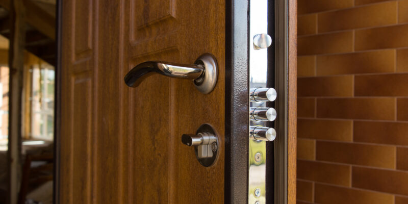 New,Steel,Three,Bolt,Door,Lock,Installed,On,The,Wooden