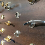 Showcase,Of,Door,Handles,And,Furniture,On,Wooden,Stand,At
