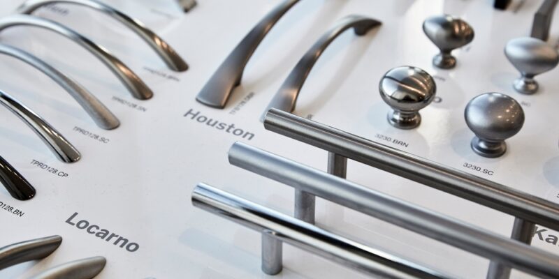 Photograph,Of,Cupboard,Door,Handles,In,A,Kitchen,Showroom.