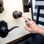 Designer,Hand,Pointing,At,Vintage,Door,Knob,With,Lock,On