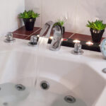 Jacuzzi,Bath,With,Water,,Candles,And,Plants